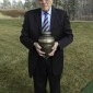Stinky Steinbrink holding urn